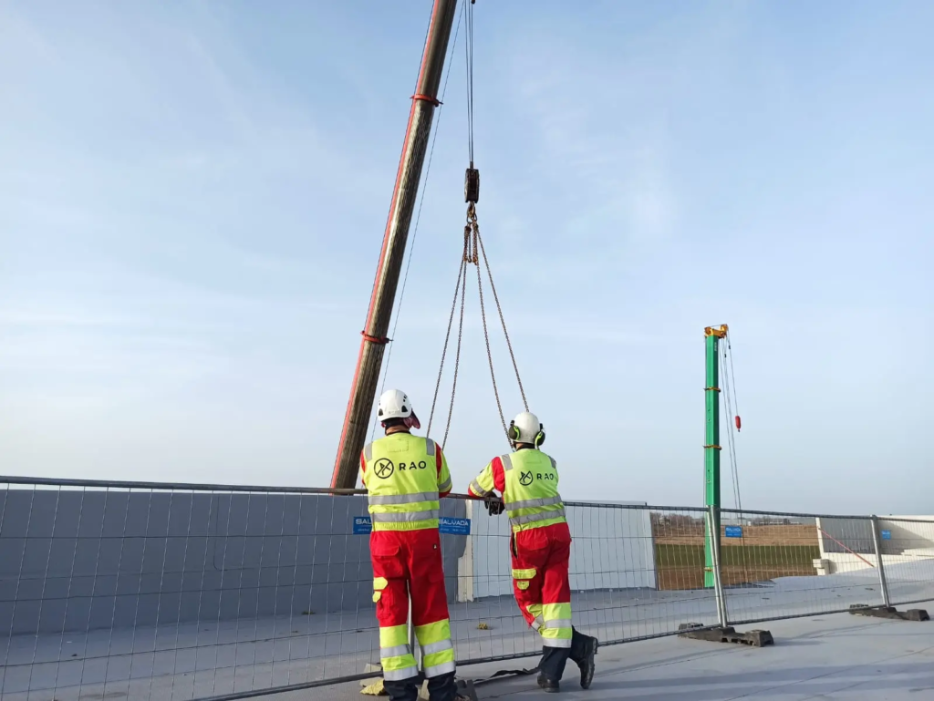 RAO riggers guiding a component during a crane lift