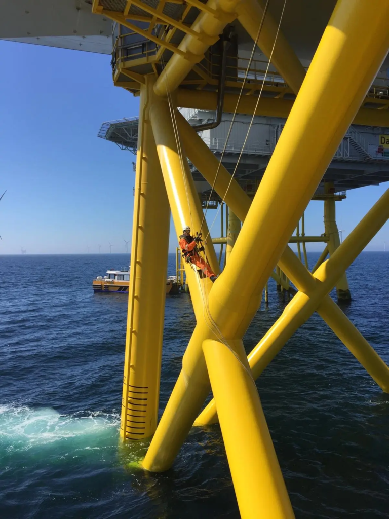 Rope Access Technician on a Yellow Offshore Foundation Structur